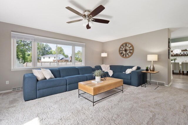 6235 George Fox Dr, Galloway, OH 43119 - carpeted living room featuring baseboards and ceiling fan