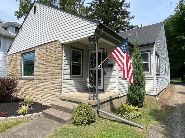 590 N 21st St, Newark, OH 43055 - view of front of house with stone siding and covered porch