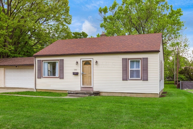 1310 Acton Rd, Columbus, OH 43224 - view of front facade featuring a chimney and a shingled roof