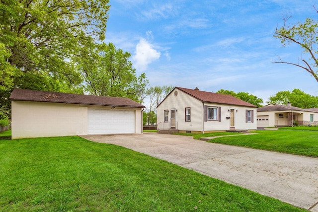 1310 Acton Rd, Columbus, OH 43224 - view of front of home featuring an outdoor structure, a front lawn, and a garage