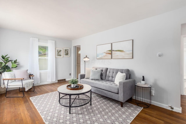 1310 Acton Rd, Columbus, OH 43224 - living room featuring hardwood / wood-style floors and baseboards