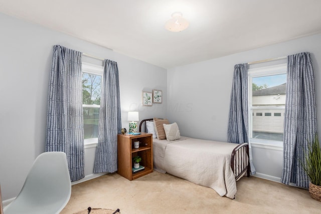1310 Acton Rd, Columbus, OH 43224 - bedroom with multiple windows and light colored carpet