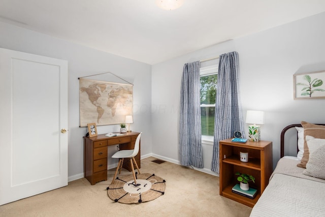 1310 Acton Rd, Columbus, OH 43224 - bedroom with carpet flooring, baseboards, and a desk