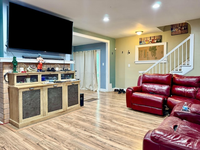 329 S Terrace Ave, Columbus, OH 43204 - living area featuring wood finished floors, stairway, baseboards, and recessed lighting