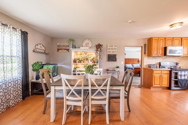 1485 E Choctaw Dr, London, OH 43140 - dining room featuring light wood-type flooring