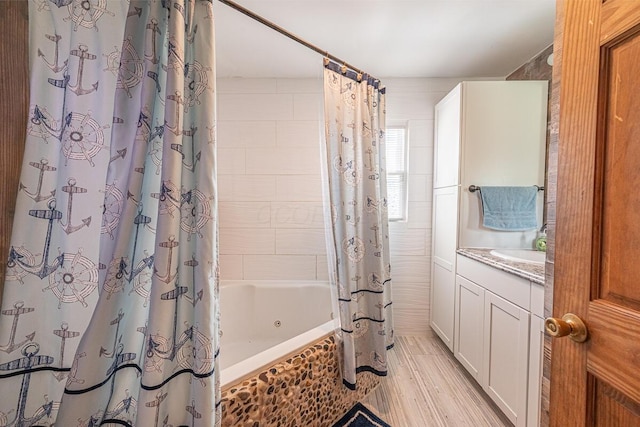 1485 E Choctaw Dr, London, OH 43140 - full bathroom with shower / bath combo with shower curtain, wood finished floors, and vanity