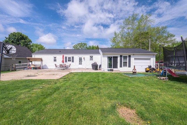 1485 E Choctaw Dr, London, OH 43140 - back of house featuring a trampoline and a patio