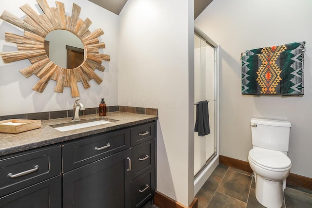 6008 Shala Cir, Nashport, OH 43830 - bathroom featuring vanity, baseboards, toilet, and a stall shower