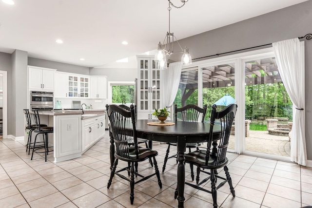 dining space with light tile patterned floors, recessed lighting, baseboards, and a chandelier