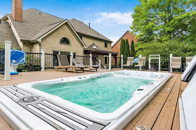 view of swimming pool featuring a deck