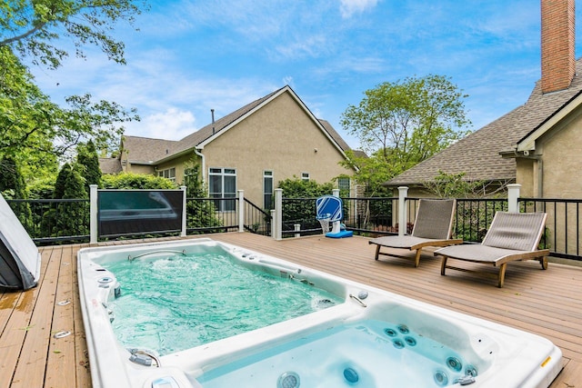 view of swimming pool featuring a wooden deck
