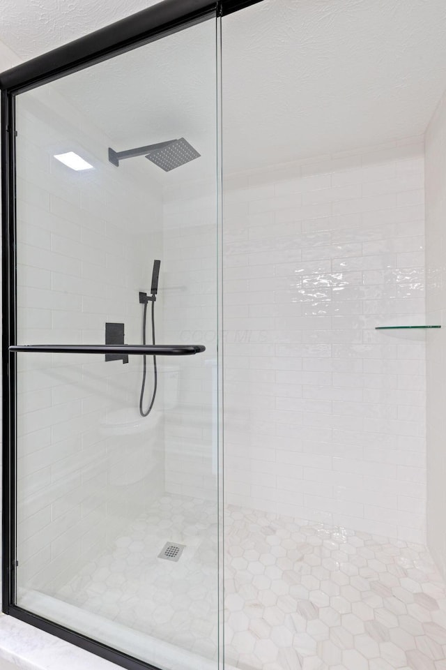 full bathroom featuring a stall shower