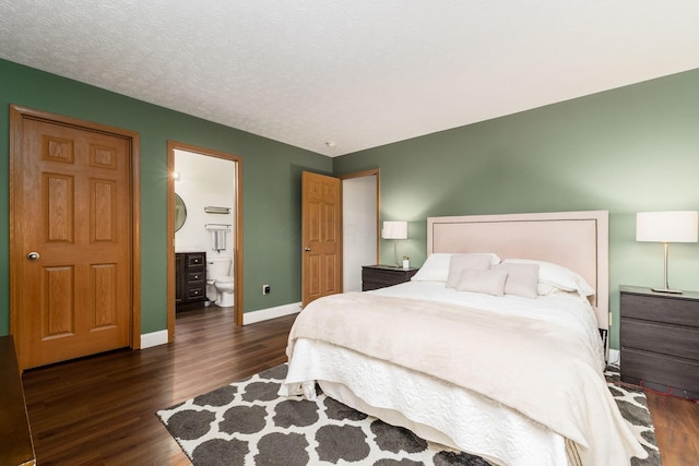 3854 Sugarbark Dr, Canal Winchester, OH 43110 - bedroom featuring wood finished floors, baseboards, and connected bathroom
