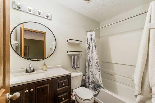 3854 Sugarbark Dr, Canal Winchester, OH 43110 - full bathroom with toilet, vanity, shower / bathtub combination with curtain, and a textured ceiling