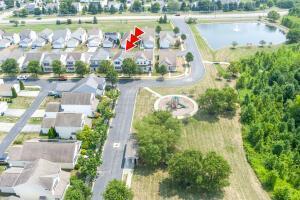 aerial perspective of suburban area with a large body of water