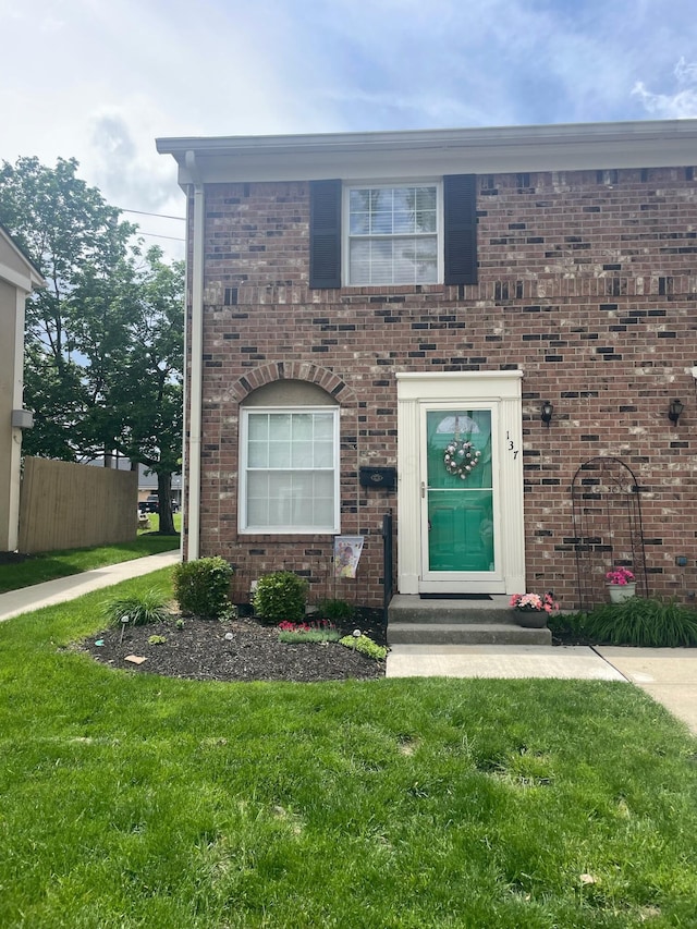 137 Tarryton Ct W Unit 24H, Columbus, OH 43228 - view of front of house with a front yard and brick siding