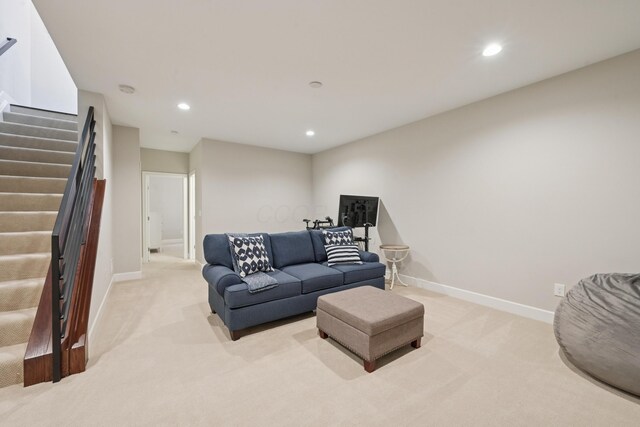 304 Cornelius St, Columbus, OH 43215 - living area with stairway, carpet floors, baseboards, and recessed lighting