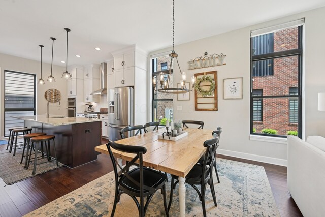 304 Cornelius St, Columbus, OH 43215 - dining room with dark wood-style flooring, recessed lighting, a chandelier, and baseboards