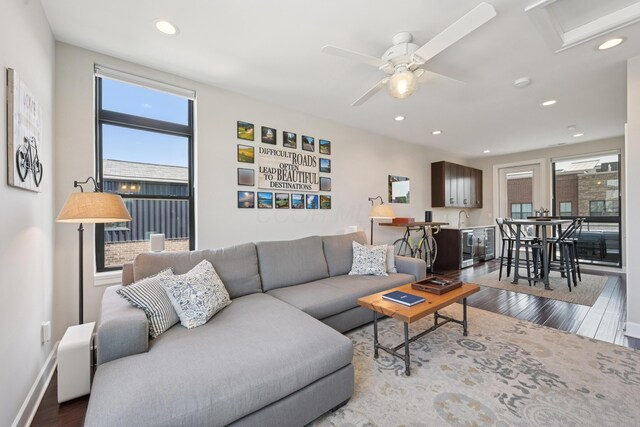 304 Cornelius St, Columbus, OH 43215 - living room featuring wood finished floors, healthy amount of natural light, recessed lighting, baseboards, and a ceiling fan