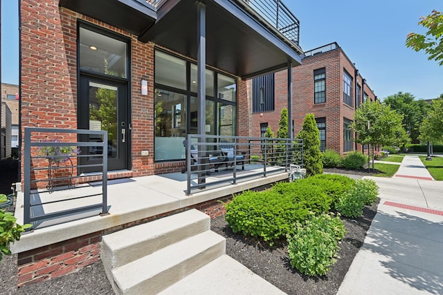 304 Cornelius St, Columbus, OH 43215 - property entrance featuring brick siding and a porch