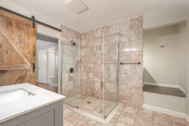 bathroom featuring a shower stall and vanity