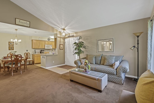 577 S Market St, Lithopolis, OH 43136 - living room featuring light carpet, vaulted ceiling, a chandelier, and baseboards