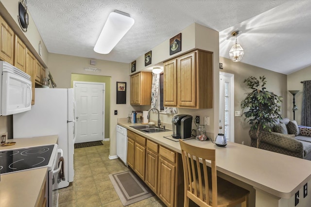 577 S Market St, Lithopolis, OH 43136 - kitchen with white appliances, a sink, light countertops, a breakfast bar area, and a peninsula