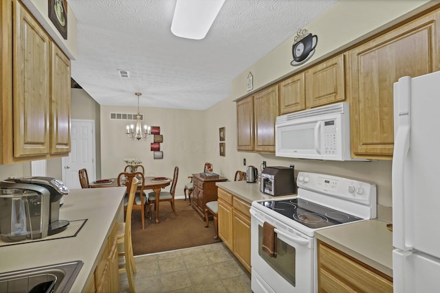 577 S Market St, Lithopolis, OH 43136 - kitchen featuring white appliances, a chandelier, light countertops, pendant lighting, and a textured ceiling