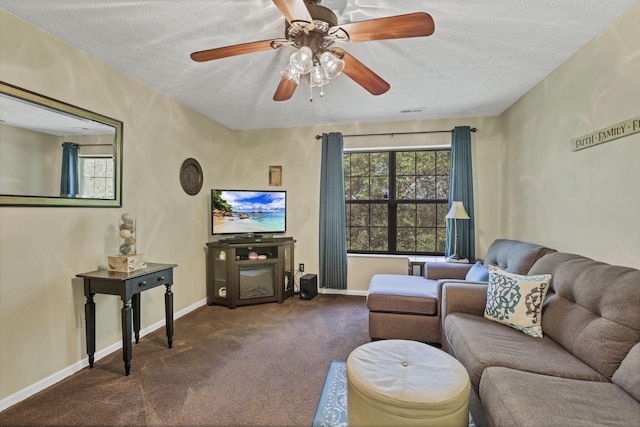 577 S Market St, Lithopolis, OH 43136 - carpeted living area featuring baseboards, ceiling fan, and a textured ceiling