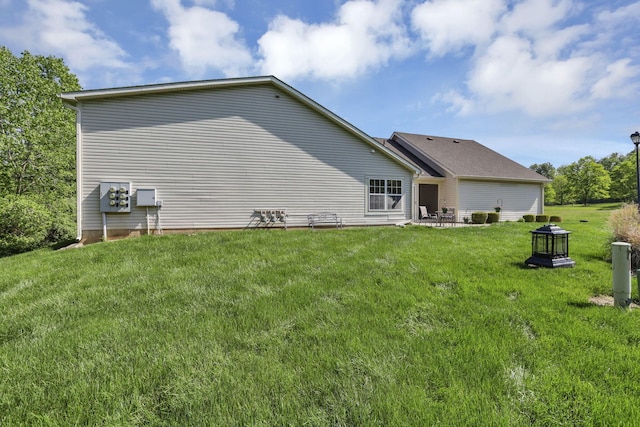 577 S Market St, Lithopolis, OH 43136 - rear view of house with a lawn and a patio area