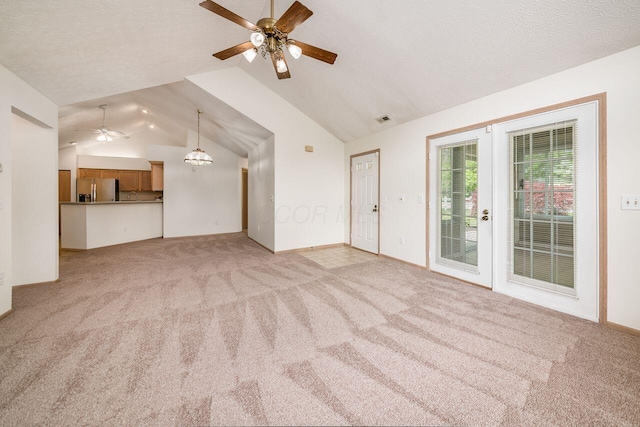 6323 Pinehurst Pointe, Westerville, OH 43082 - unfurnished living room featuring a ceiling fan, vaulted ceiling, and light carpet