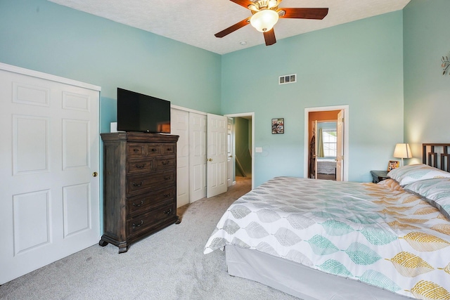5210 Novelty Ave Unit 73D, Canal Winchester, OH 43110 - bedroom with light carpet, a towering ceiling, and a ceiling fan