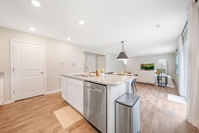 385 Kells Ct E, Newark, OH 43055 - kitchen featuring dishwasher, a sink, white cabinetry, light wood finished floors, and a center island with sink