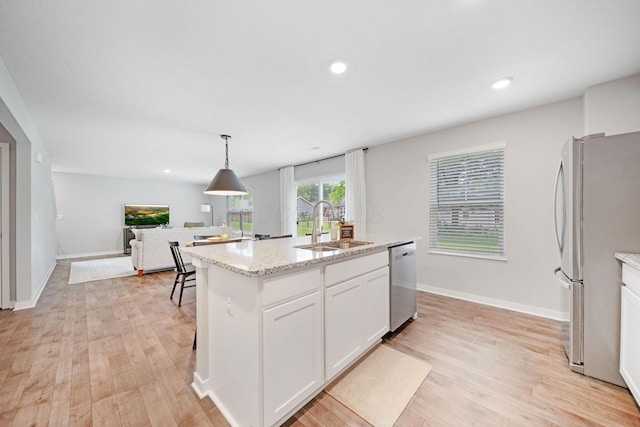 385 Kells Ct E, Newark, OH 43055 - kitchen with appliances with stainless steel finishes, a sink, light wood-style floors, white cabinetry, and recessed lighting