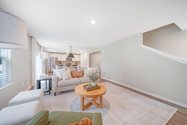 385 Kells Ct E, Newark, OH 43055 - living room featuring baseboards, light wood-type flooring, and recessed lighting