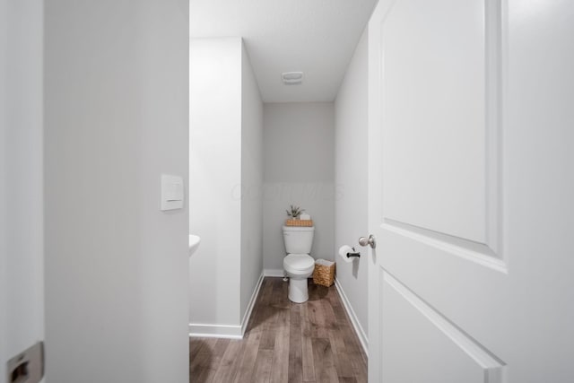 385 Kells Ct E, Newark, OH 43055 - bathroom featuring toilet, wood finished floors, and baseboards