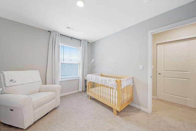 385 Kells Ct E, Newark, OH 43055 - bedroom with light carpet, a crib, and baseboards