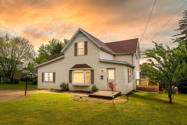 692 Millsboro Rd, Mansfield, OH 44903 - traditional-style house with a front yard, a shingled roof, and a wooden deck