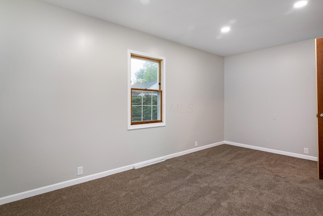 692 Millsboro Rd, Mansfield, OH 44903 - spare room featuring dark colored carpet, recessed lighting, and baseboards
