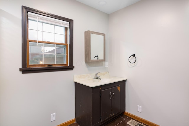 692 Millsboro Rd, Mansfield, OH 44903 - bathroom with baseboards, vanity, and wood finished floors