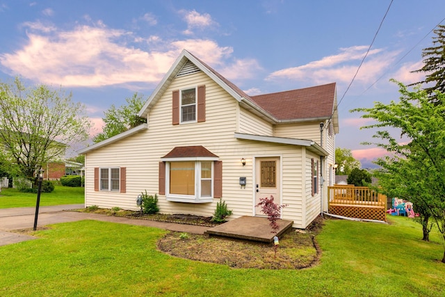 692 Millsboro Rd, Mansfield, OH 44903 - traditional-style house featuring a lawn, a deck, and a shingled roof