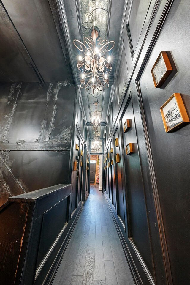 43-45 W Markison Ave, Columbus, OH 43207 - hallway with a chandelier and dark wood-style floors