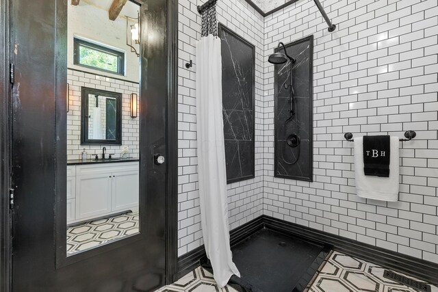 43-45 W Markison Ave, Columbus, OH 43207 - bathroom with tiled shower, vanity, and tile walls