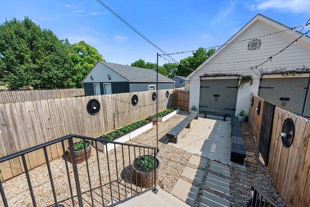 43-45 W Markison Ave, Columbus, OH 43207 - view of side of home with a garden and a fenced backyard
