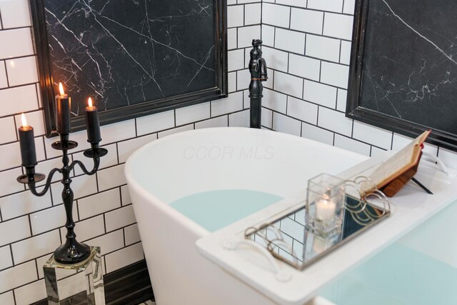 43-45 W Markison Ave, Columbus, OH 43207 - bathroom view of tile walls and a soaking tub