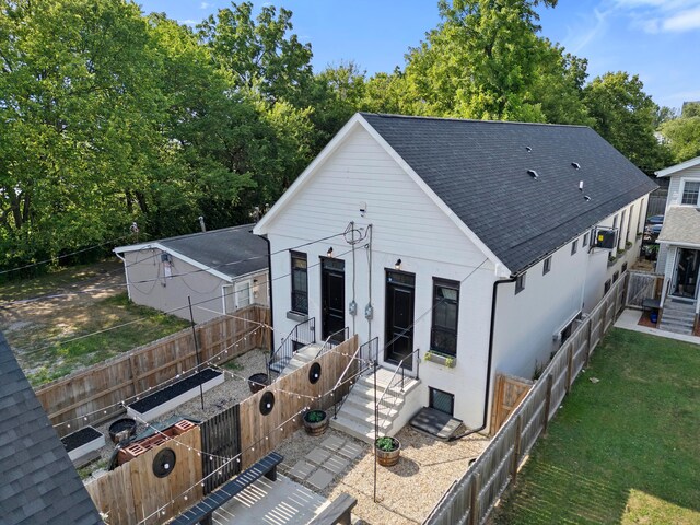 43-45 W Markison Ave, Columbus, OH 43207 - view of front of home with a shingled roof and a fenced backyard