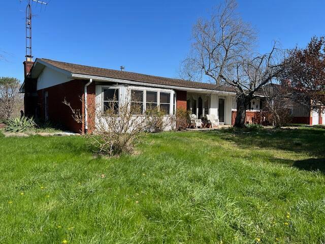 1886 Johnstown Utica Rd NE, Utica, OH 43080 - rear view of house with brick siding and a yard