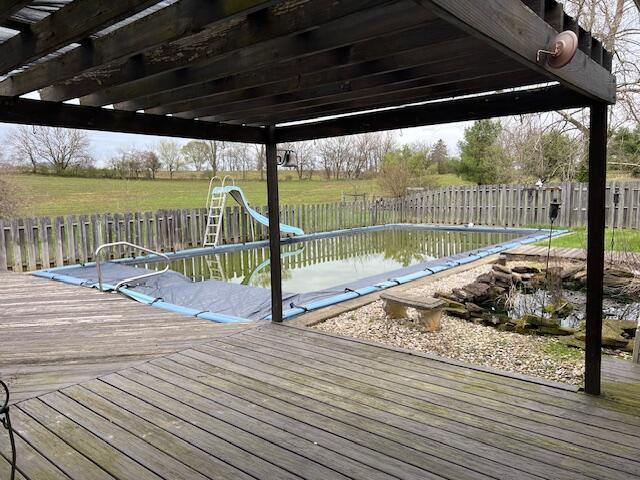 1886 Johnstown Utica Rd NE, Utica, OH 43080 - dock with a deck, a fenced backyard, and a pergola