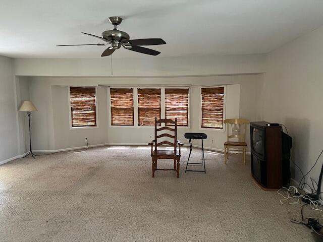 1886 Johnstown Utica Rd NE, Utica, OH 43080 - dining room with carpet flooring, ceiling fan, and baseboards