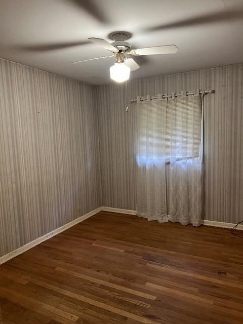 1886 Johnstown Utica Rd NE, Utica, OH 43080 - unfurnished room with wood finished floors, ceiling fan, and wooden walls